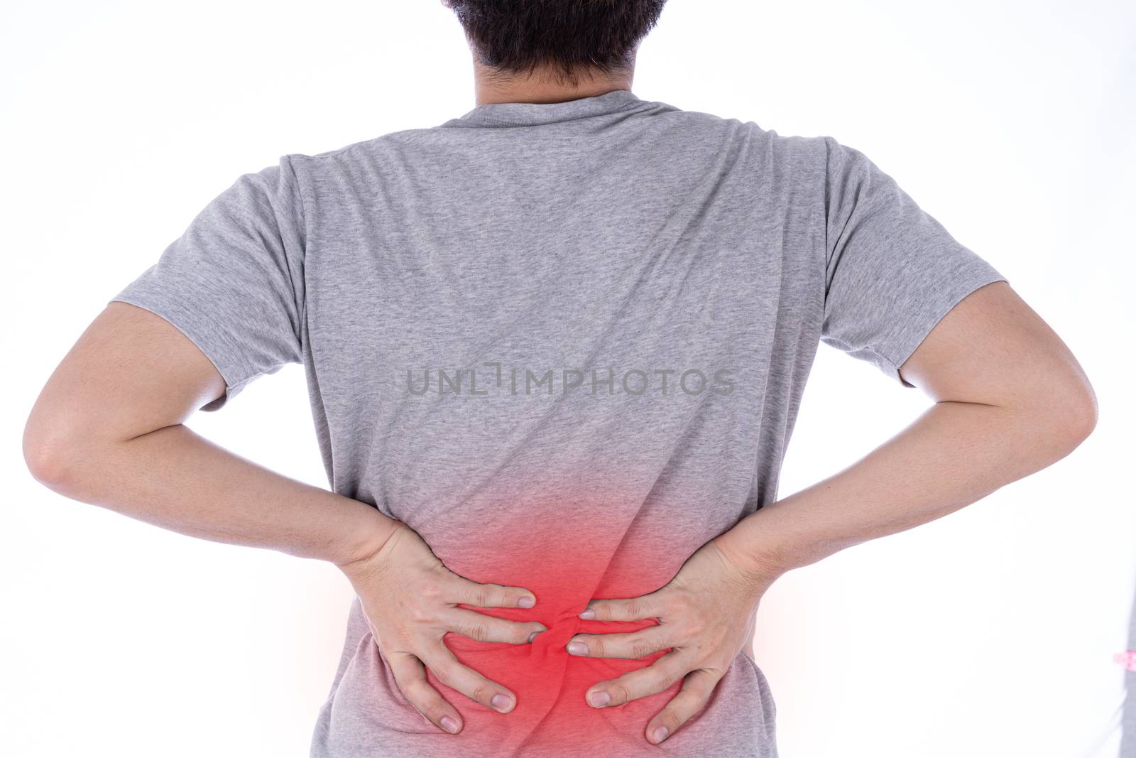 A man feeling exhausted and suffering from waist and back pain and injury on isolated white background with red spot. Health care and medical concept.