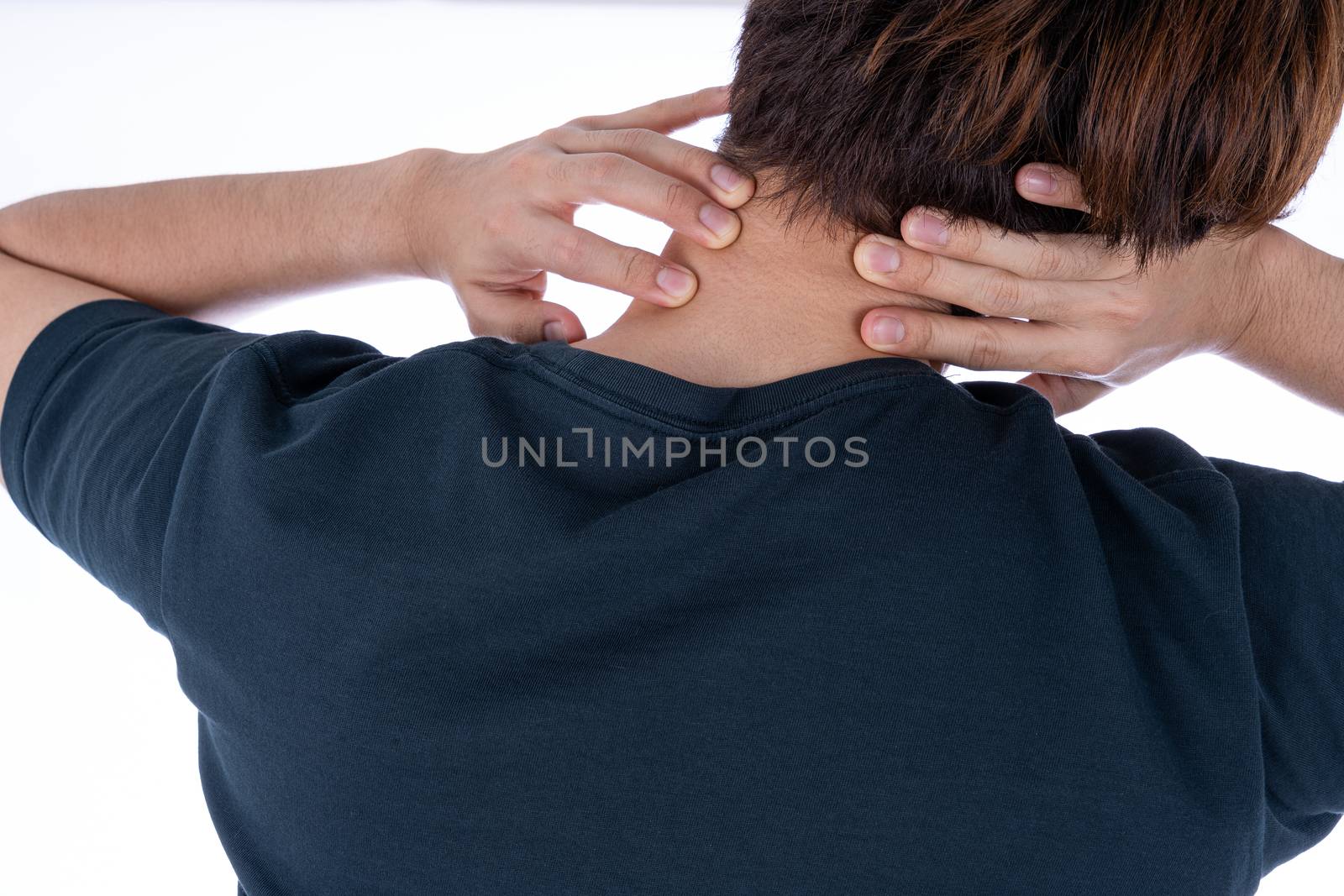 A man feeling exhausted and suffering from shoulder and neck pain and injury on isolated white background. Health care and medical concept.
