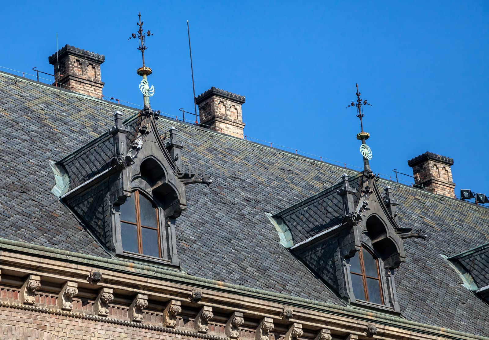 Dormer windows on the roof of gothic building in Prague