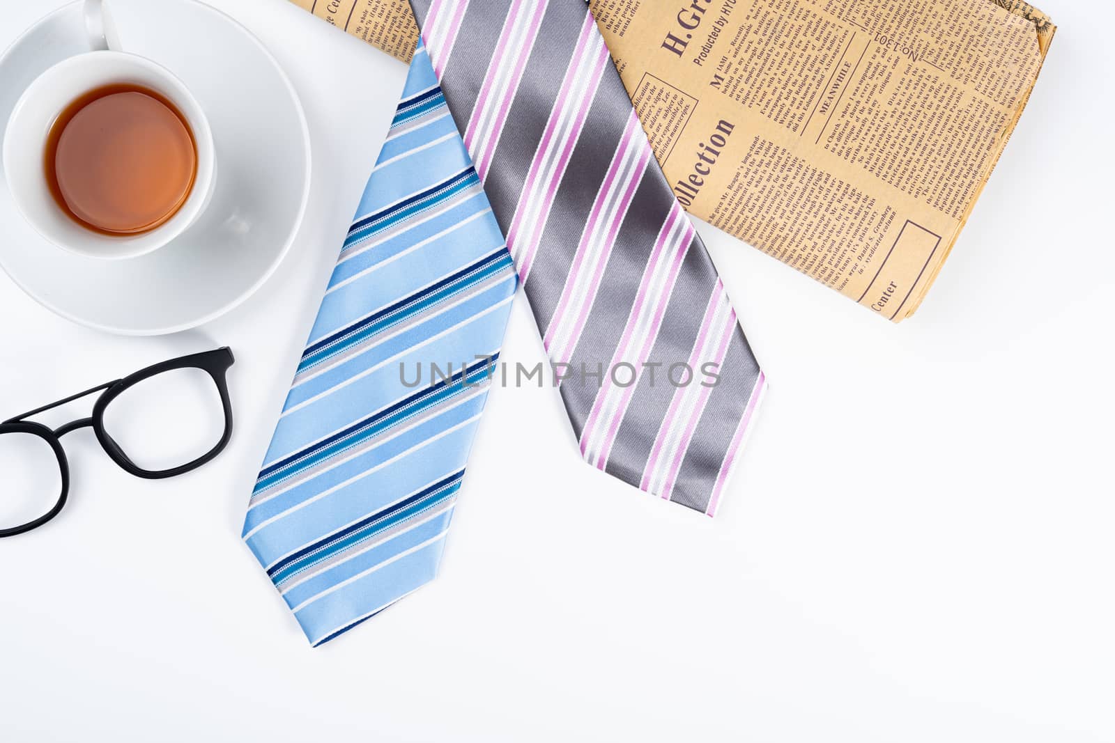 Happy Father Day background concept with blue and pink necktie, cup of tea and glasses on white background with copy space for text.