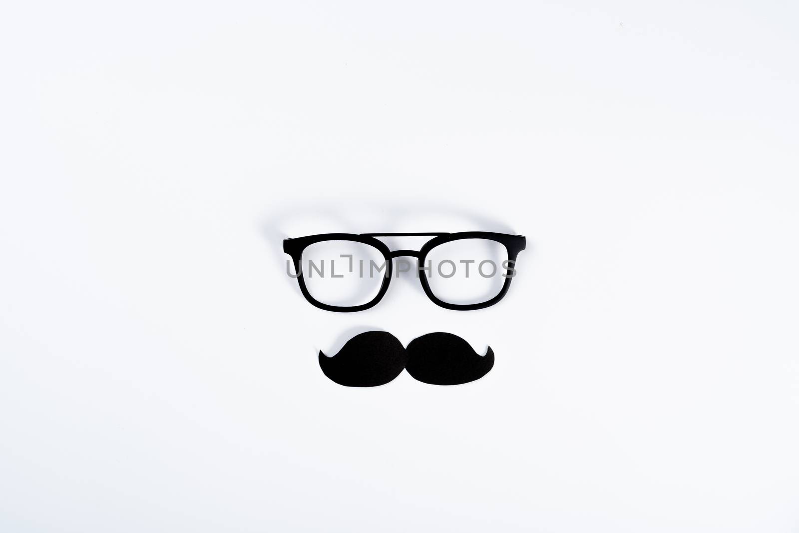 Happy Father Day background concept with glasses and black mustache on white background with copy space for text.