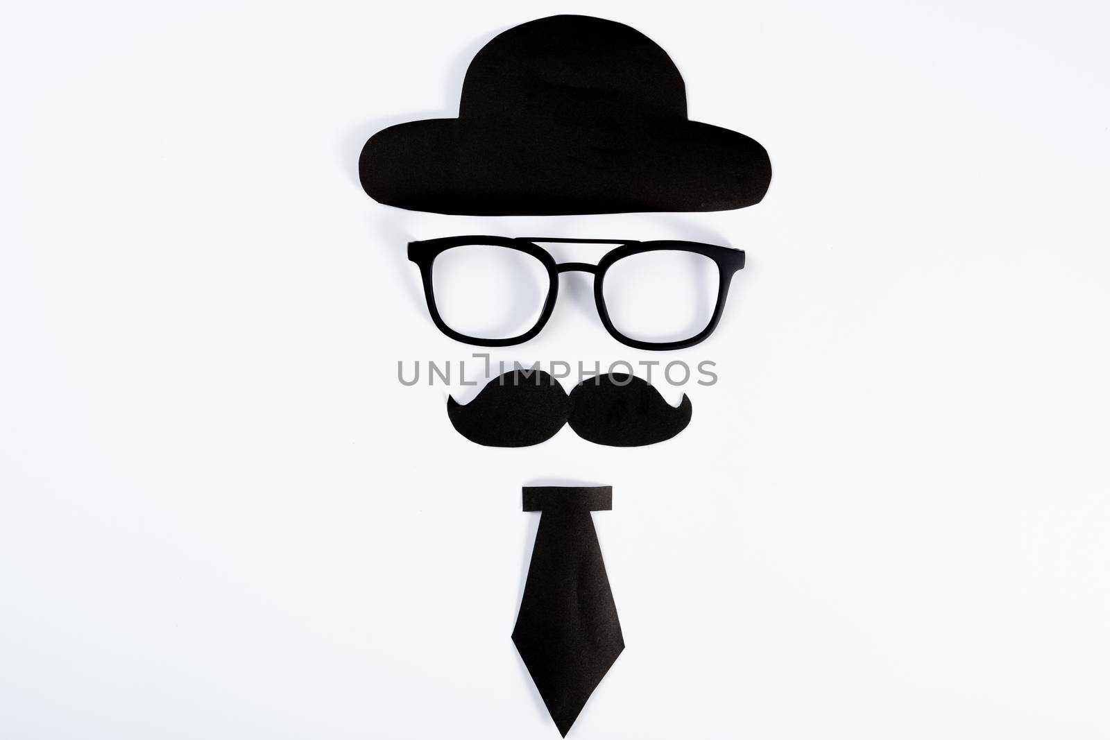 Happy Father Day background concept with paper cut of hat, glasses, black mustache and necktie on white background with copy space for text.