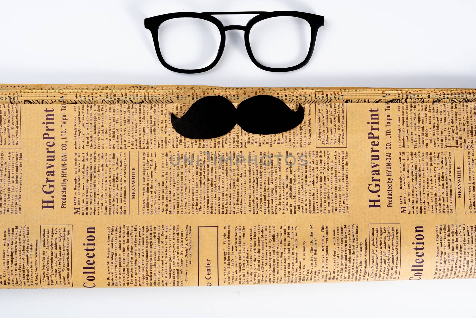 Happy Father Day background concept with glasses, newspaper and black mustache on white background with copy space for text.