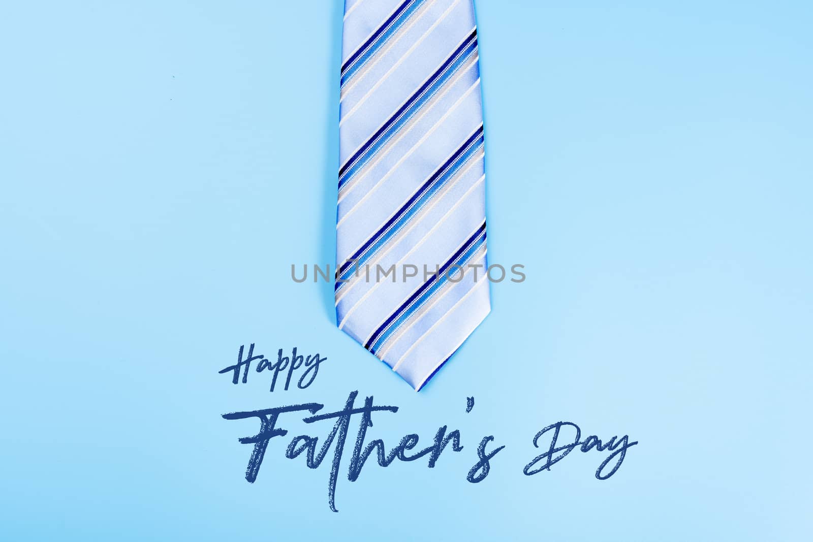 Happy Father Day background concept with blue necktie on blue background with copy space for text.
