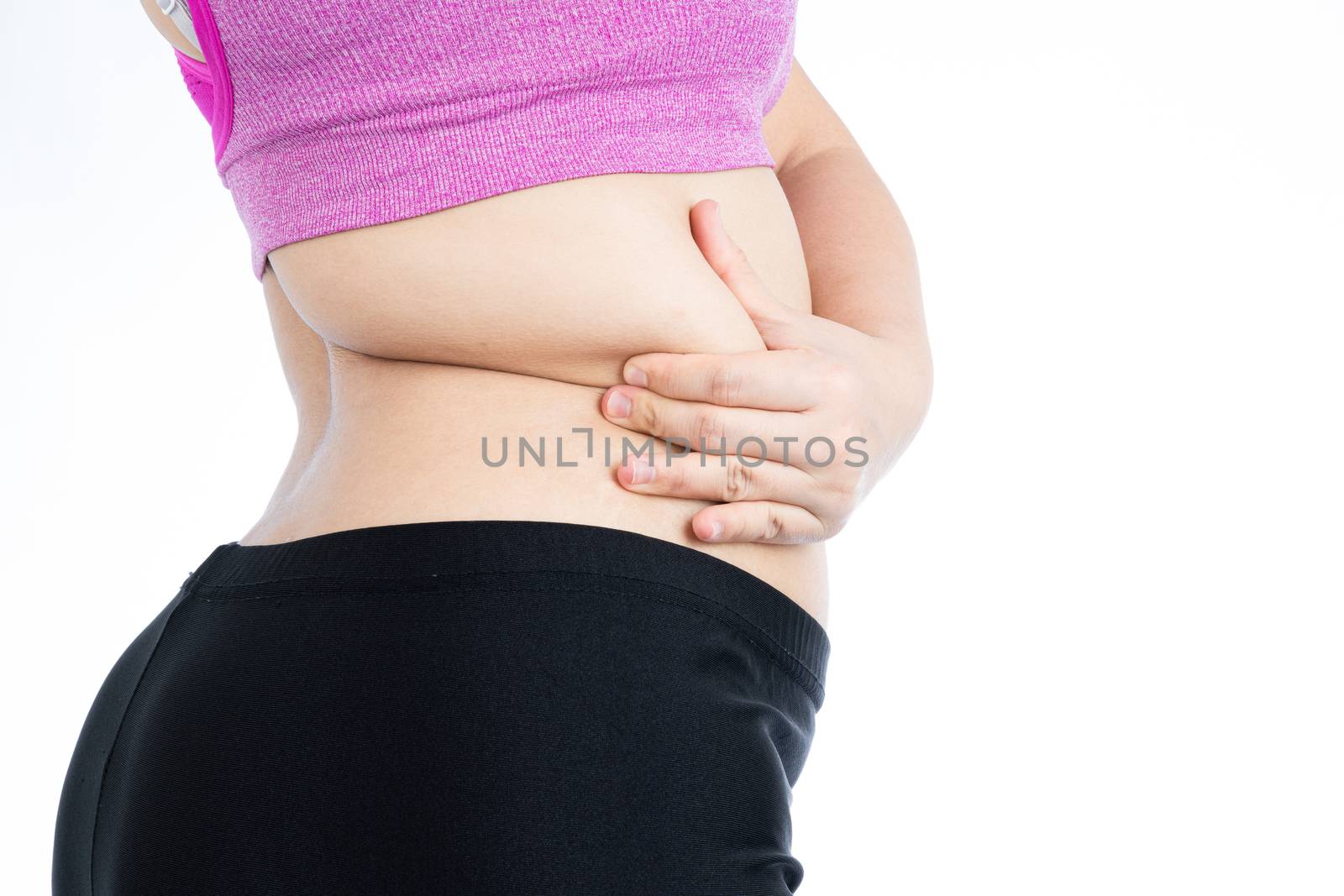 Fat woman holding excessive fat belly lower back, overweight fatty belly isolated on over white background. Diet lifestyle, weight loss, stomach muscle, healthy concept.