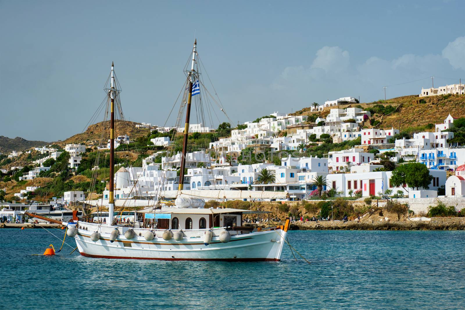 Vessel schooner moored in port harbor of Chora town, Mykonos island, Greece
