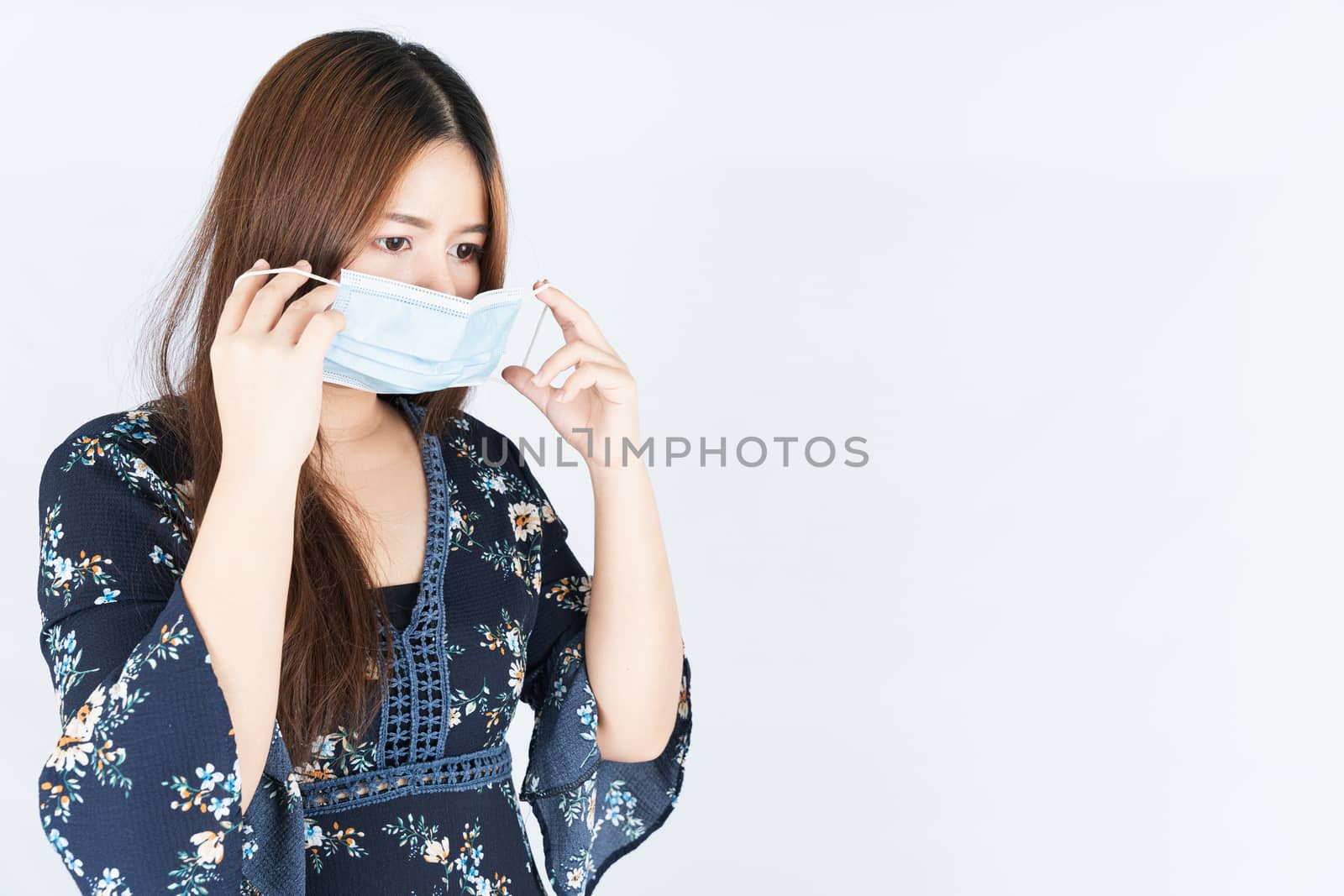 Asian beautiful happy hipster woman wearing a medical protection face mask for protect the coronavirus, filter dust PM 2.5 and cold on white background