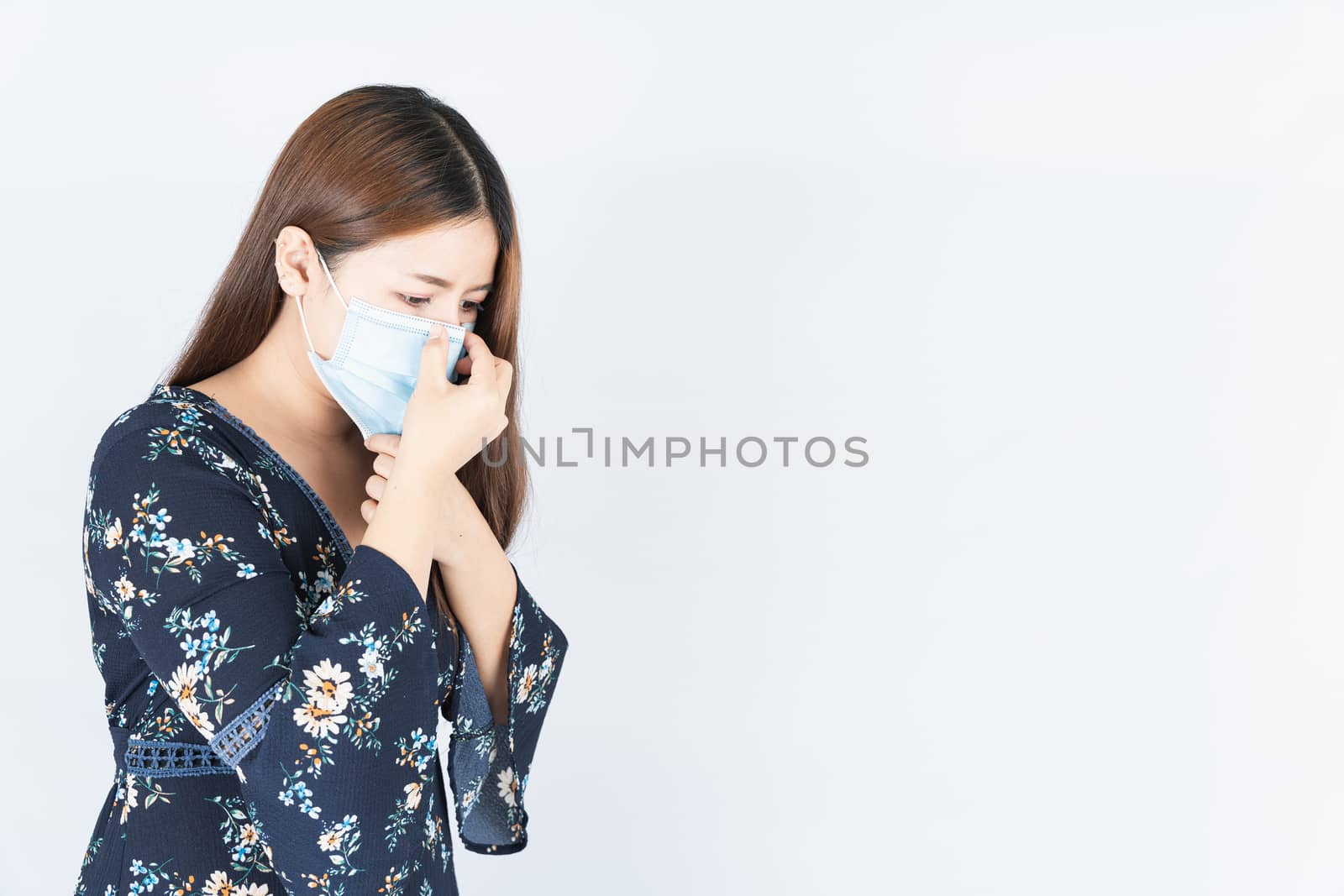 Asian beautiful happy hipster woman wearing a medical protection face mask for protect the coronavirus, filter dust PM 2.5 and cold on white background