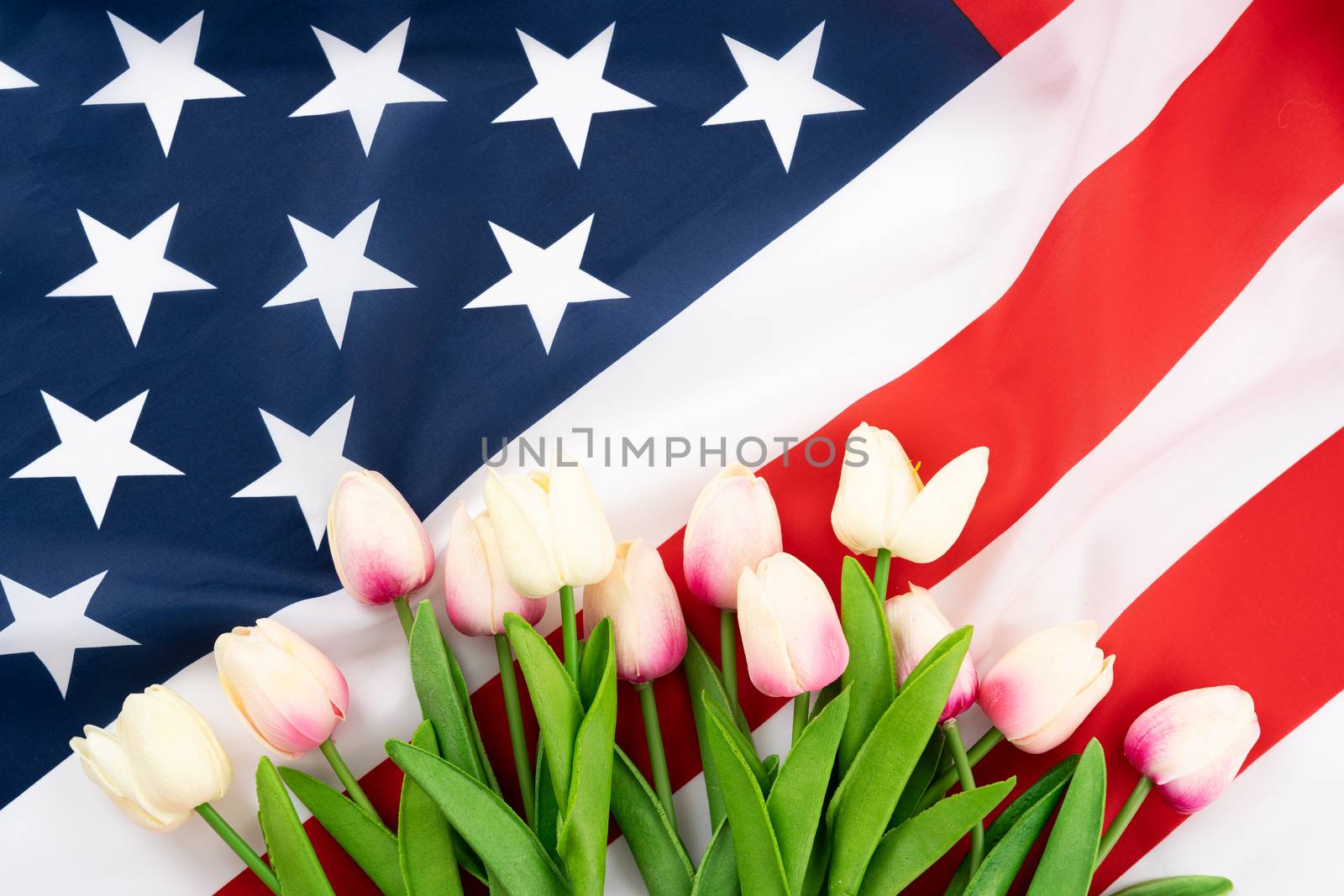 US American flag on white background. For USA Memorial day,  Memorial day, Presidents day, Veterans day, Labor day, Independence day, or 4th of July celebration. Top view, copy space for text.