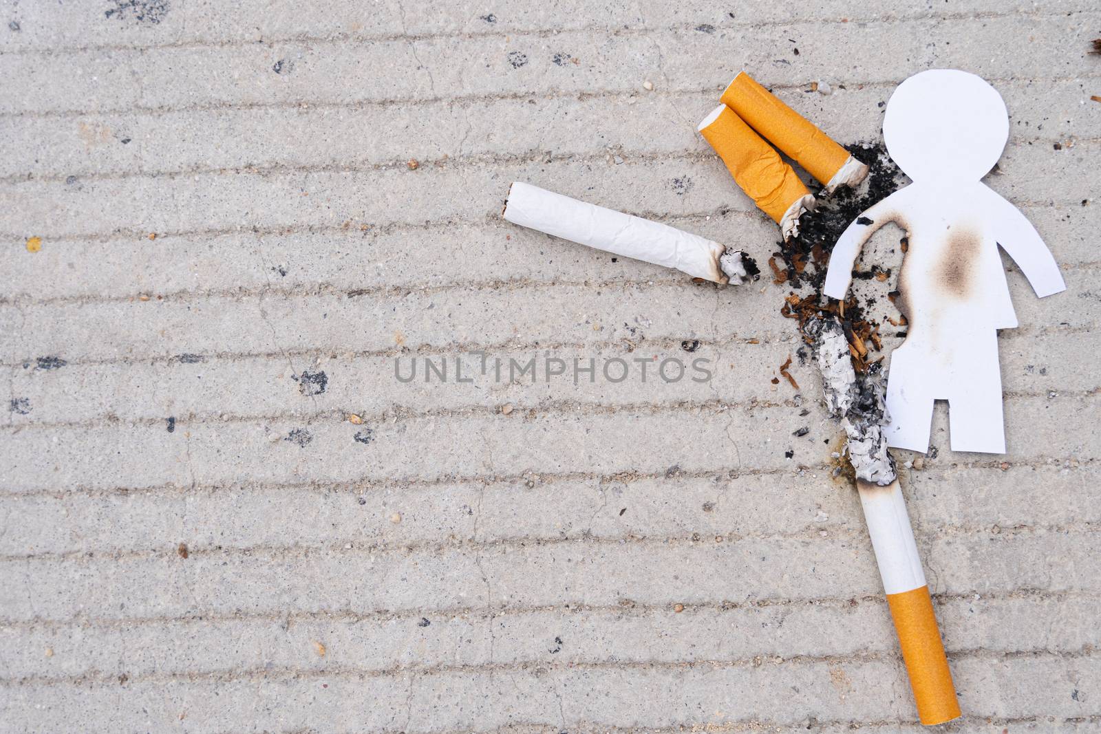 Paper cut of man destroyed by cigarette. Smoking destroying life concept. Quit smoking for life on world tobacco day.