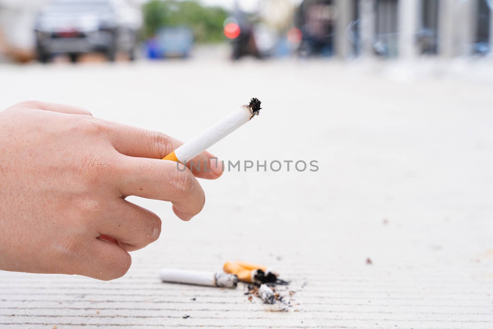 Man hold a cigarette with his hand. Stop smoking campaign. World no tobacco day.