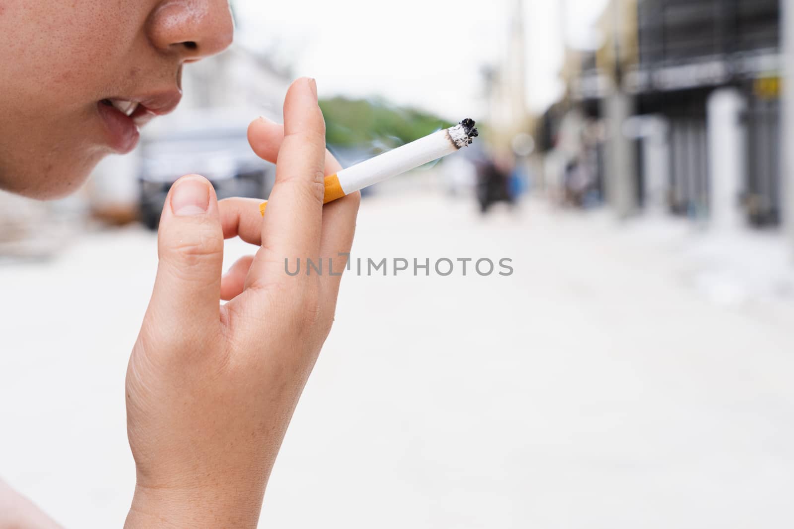 Close-up of someone light a cigarette. World no tobacco day conc by mikesaran