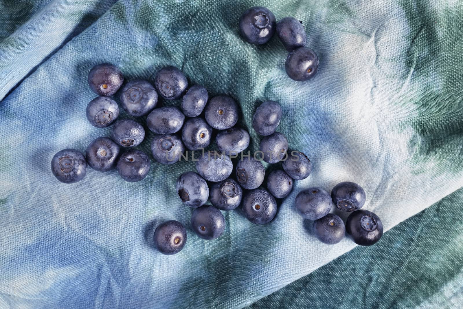 Fresh blueberries on colored cloth by victimewalker