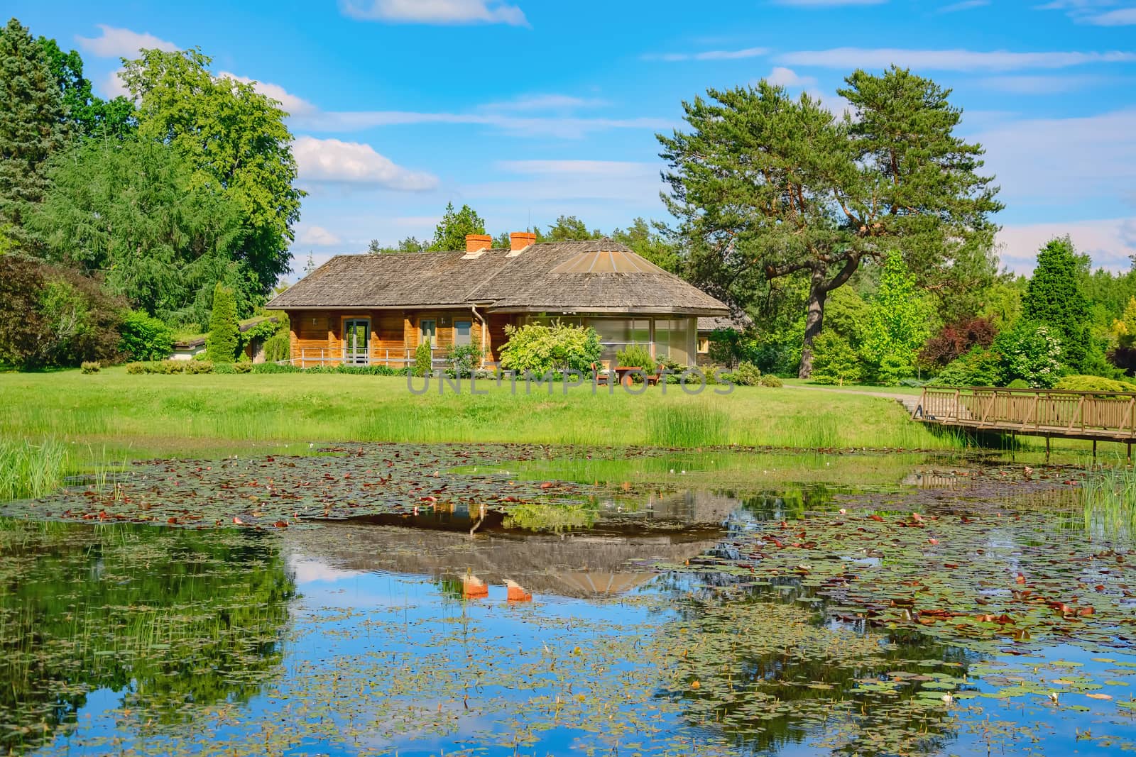 House near the pond in the rural area