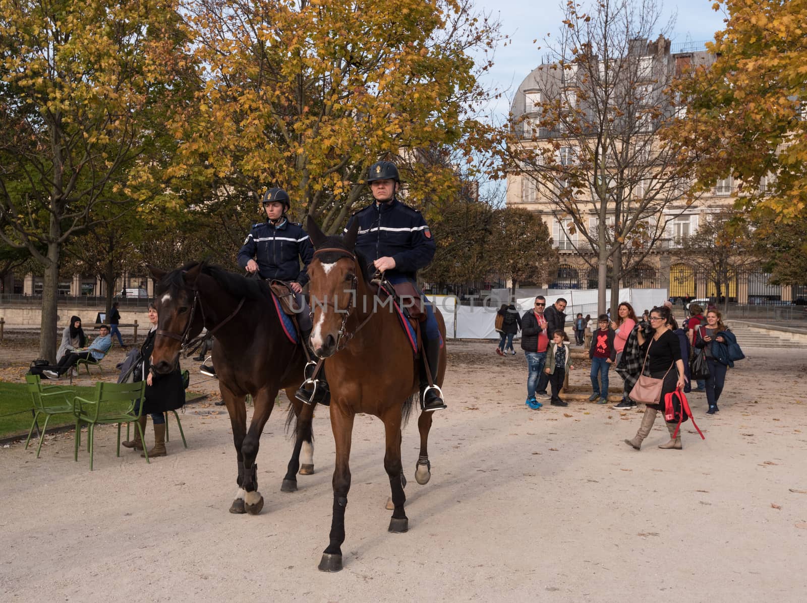 Paris, France -- November 3, 2017 -- Mounted French police officers patrol the Tuileries Gardens.