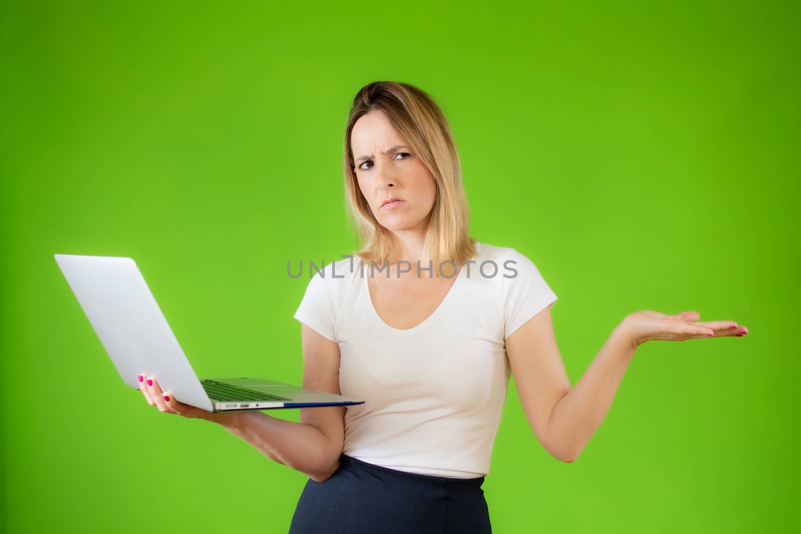 Pretty young woman in white shirt using a computer