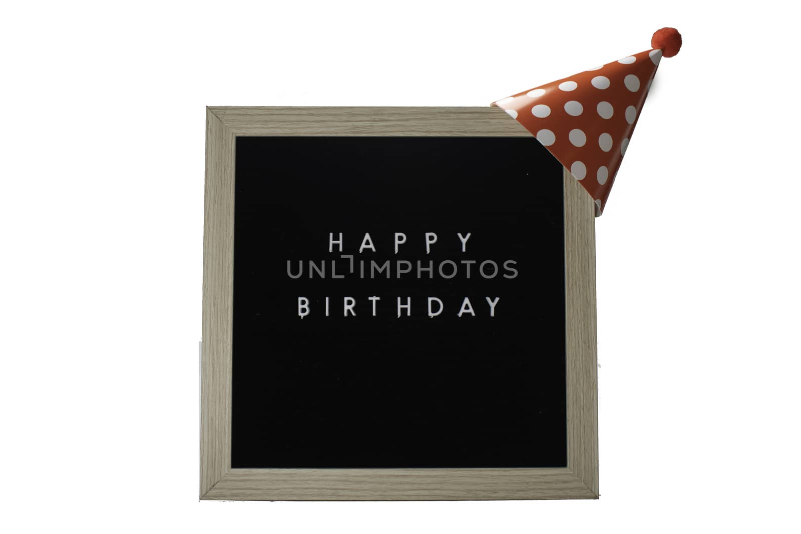 A Birch Framed Sign That Says Happy Birthday in White Letters With a Red Party Hat on Top on a Pure White Background