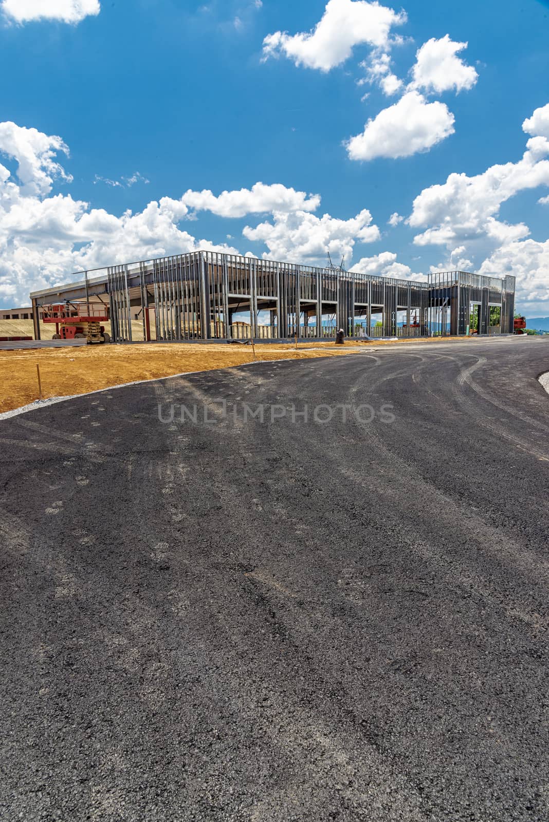 New Blacktop Leading To Commercial Construction Site by stockbuster1
