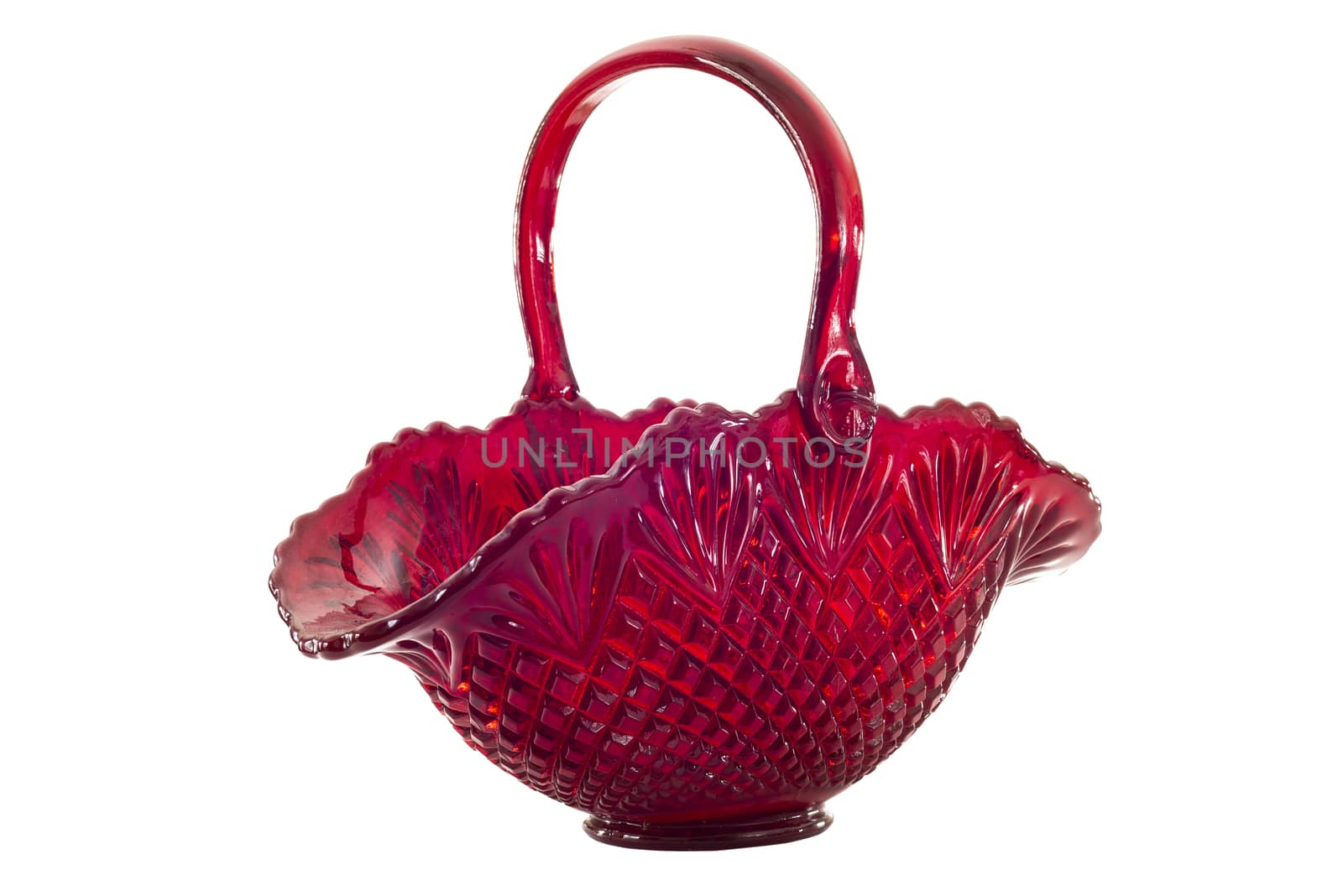 Horizontal side view shot of a beautiful old red glass basket with a handle.  Shot on a white background.