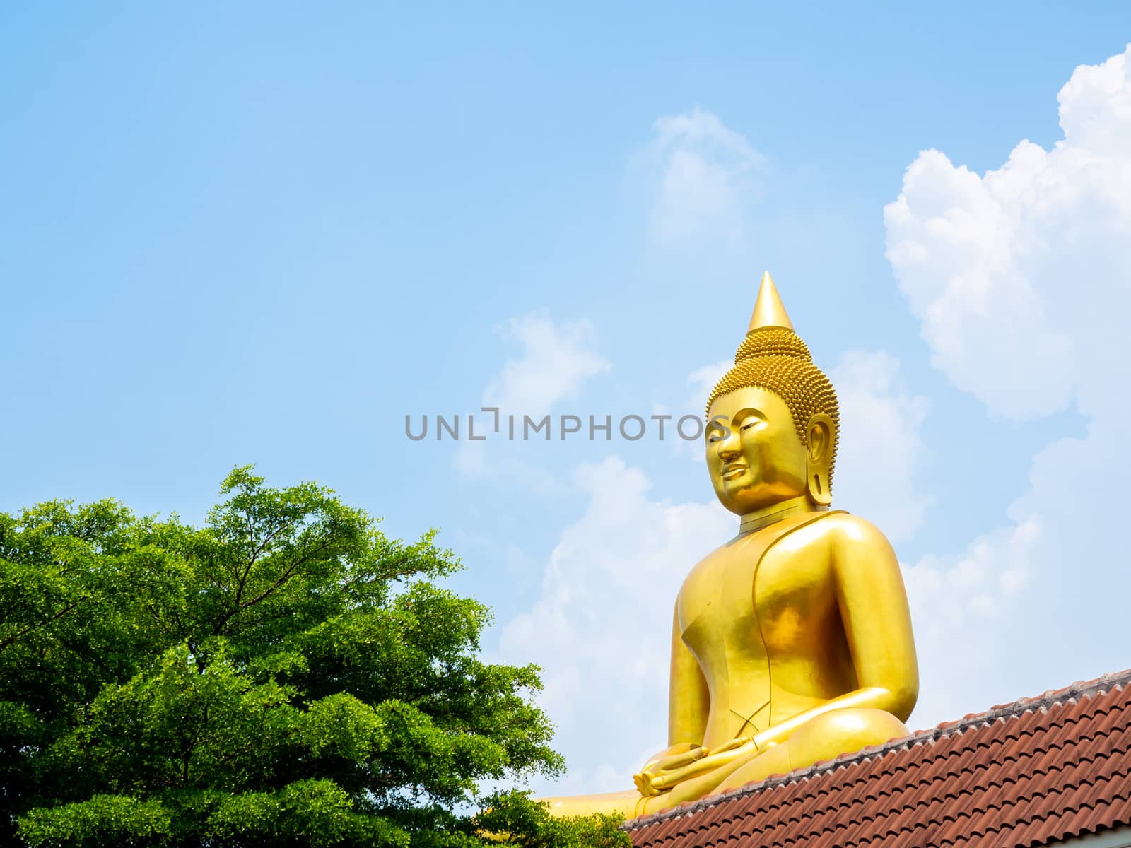 PATHUM THANI, THAILAND - May 2 : 2020. Beautiful big buddha "Luang Phor Sothorn" on blue sky background at Wat Bot Temple at Pathum Thani, THAILAND.