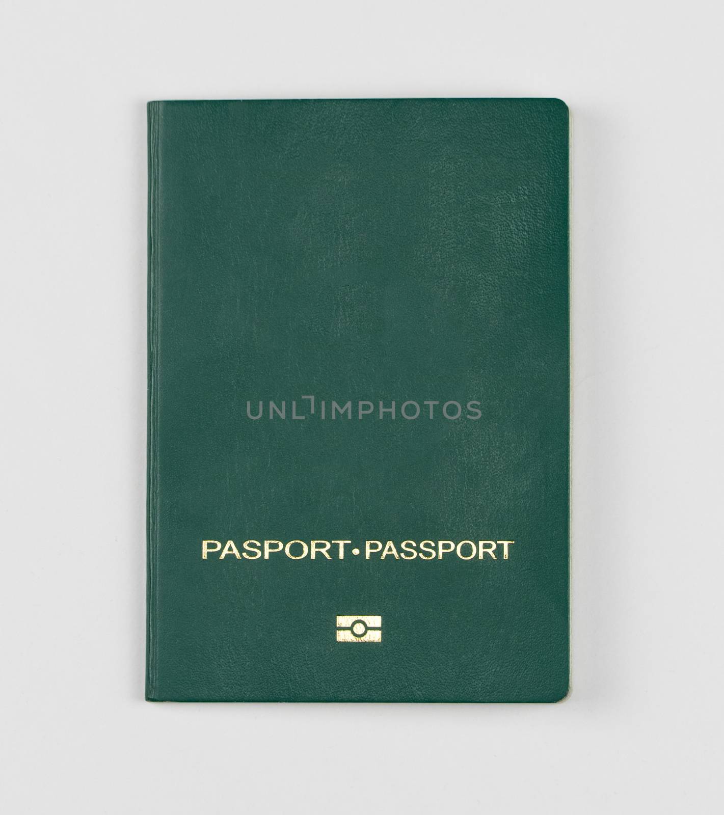 green passport on a white background, isolated, top view