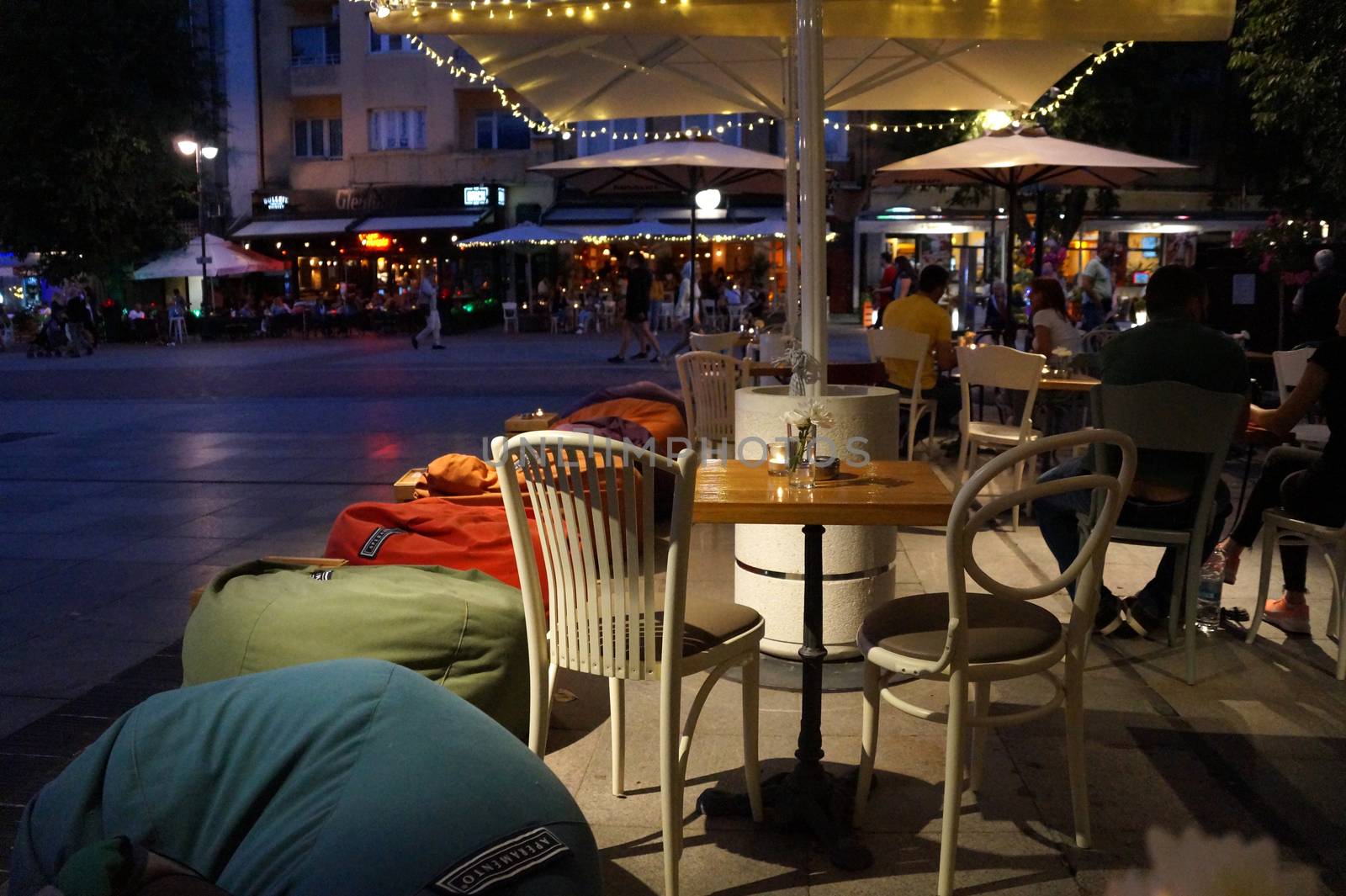 Varna, Bulgaria - July, 13,2020: street cafe on the central street of Varna in the evening.