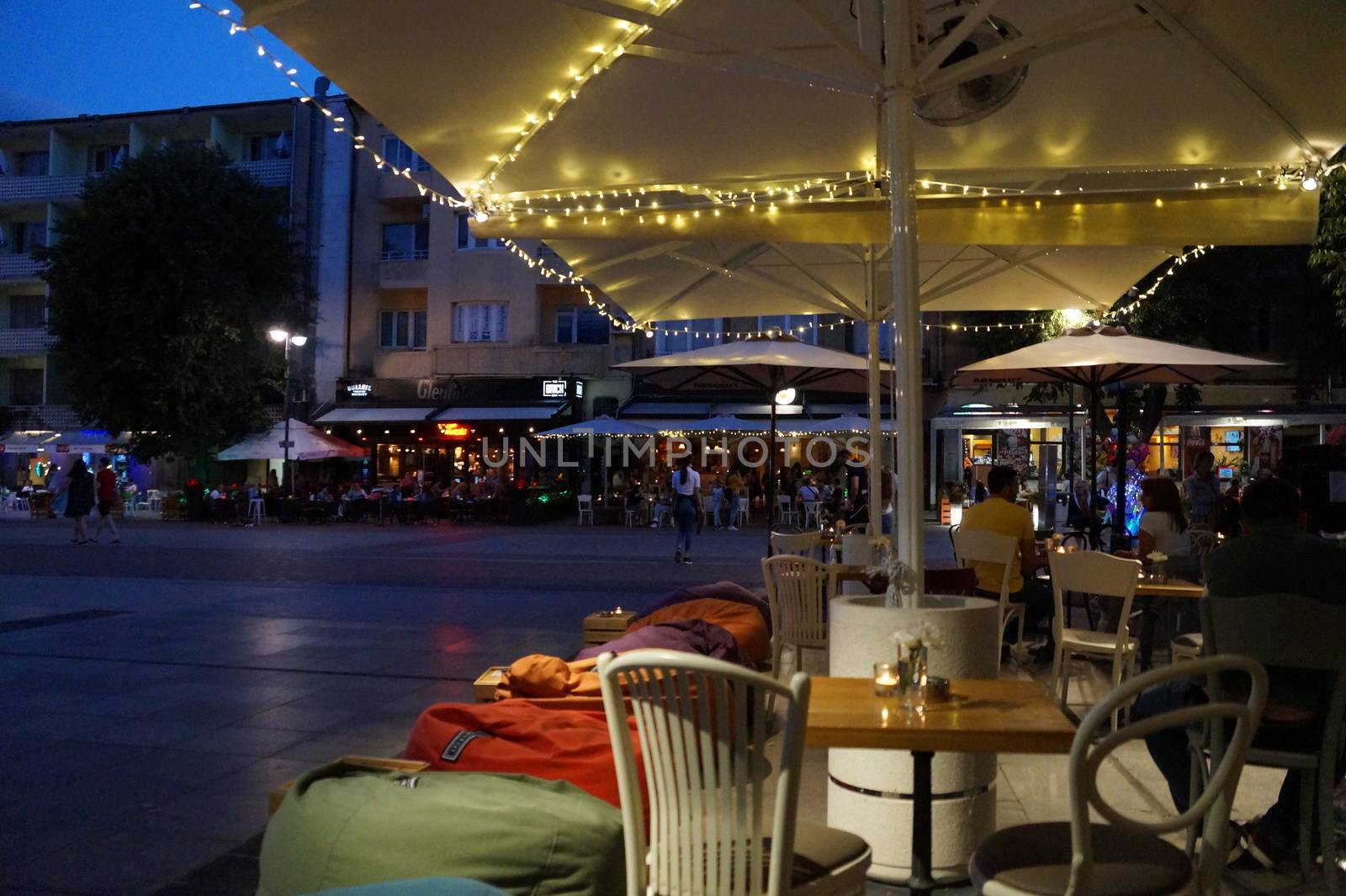 Varna, Bulgaria - July, 13,2020: street cafe on the central street of Varna in the evening.
