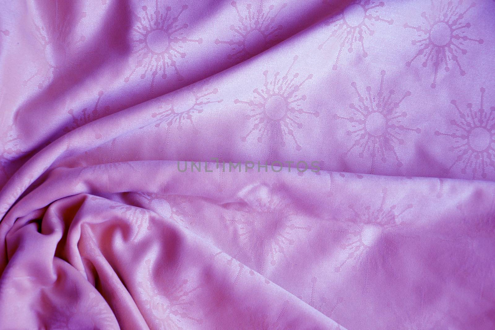 texture of pink textile material in a fold for background by Annado