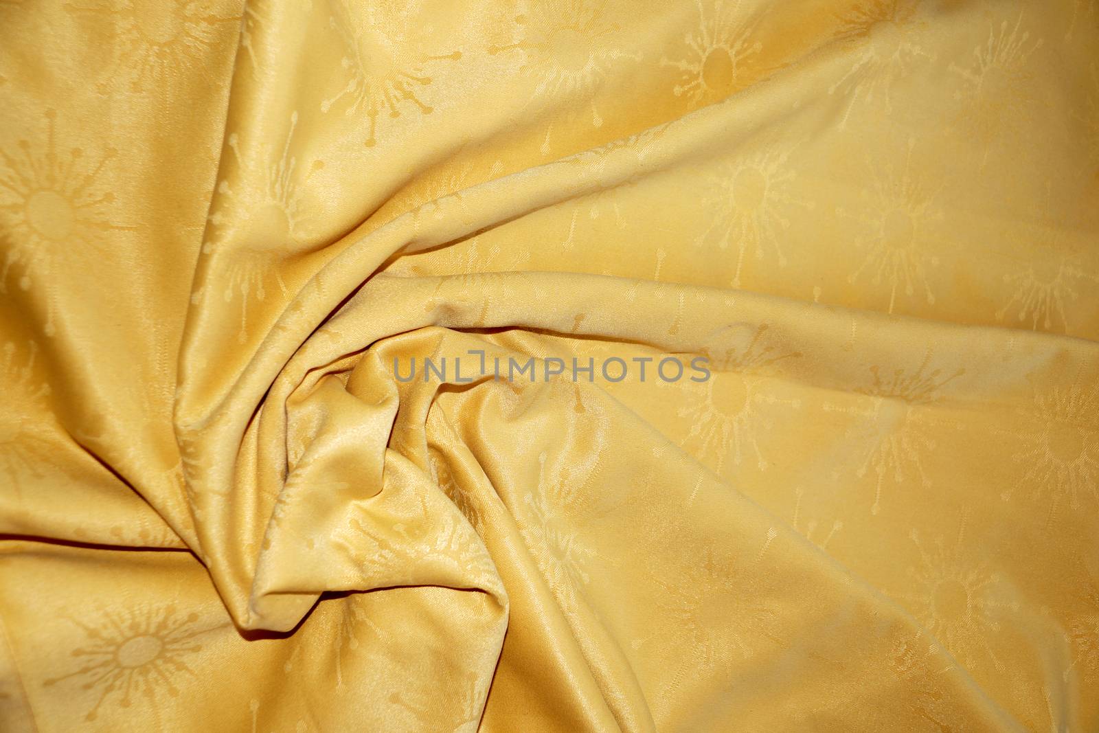 texture of golden textile material in a fold for background by Annado