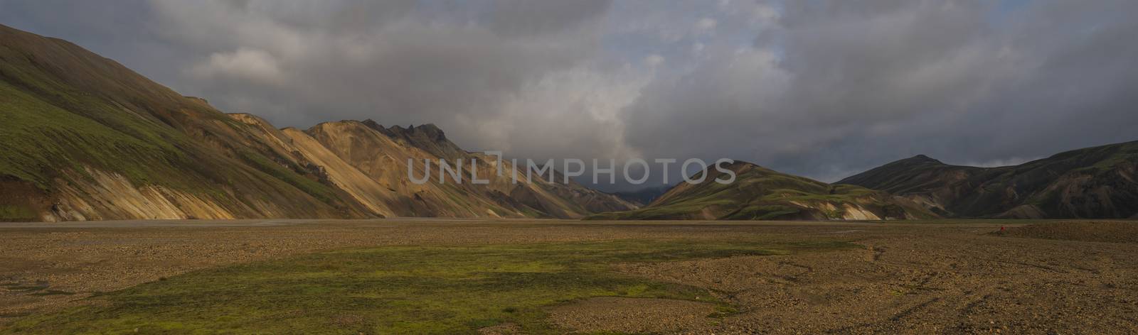 Beautiful scenic panorama of colorful volcanic mountains in Landmannalaugar camp site area of Fjallabak Nature Reserve in Highlands region of Iceland.