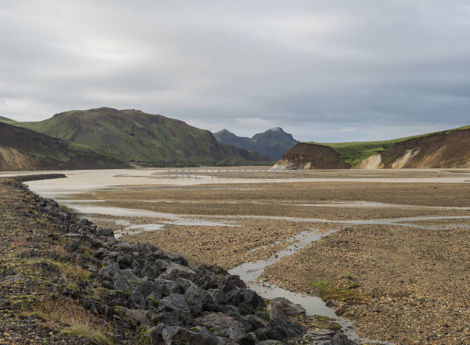 Beautiful scenic panorama of colorful volcanic mountains in Landmannalaugar camp site area of Fjallabak Nature Reserve in Highlands region of Iceland.