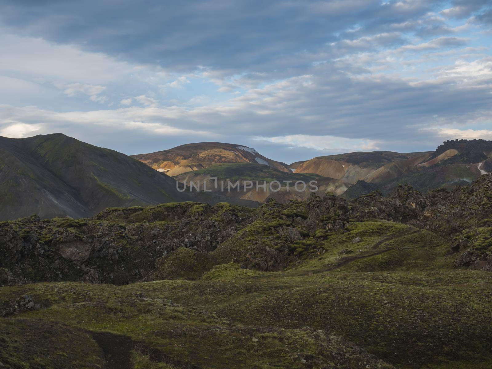 Colorful Rhyolit mountain panorma with multicolored volcanos in Landmannalaugar area of Fjallabak Nature Reserve in Highlands region of Iceland.