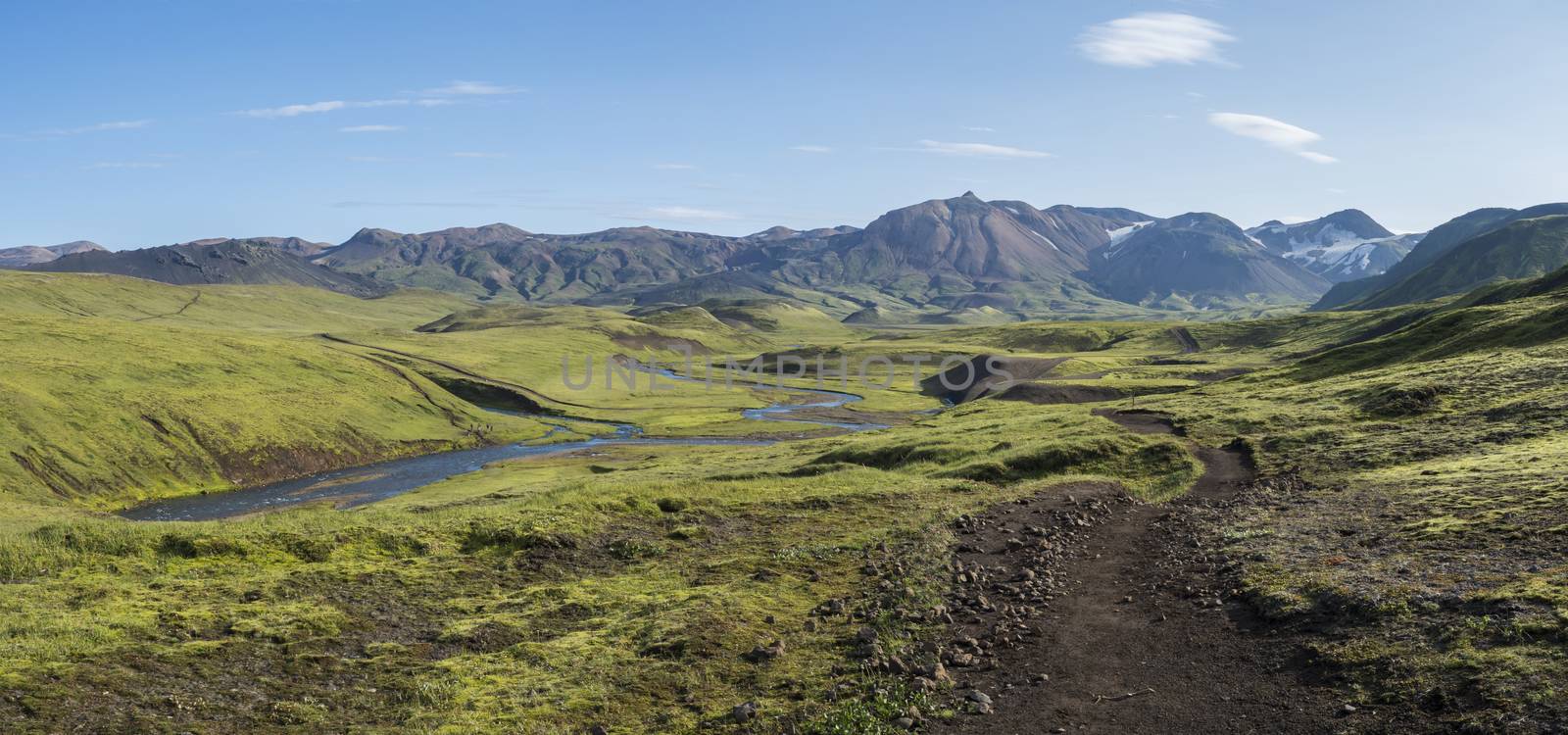 Panoramic landscape with blue river stream, green hills, snow-capped mountains, meadow and lush moss. Laugavegur hiking trail. with Fjallabak Nature Reserve, Iceland. Summer blue sky by Henkeova