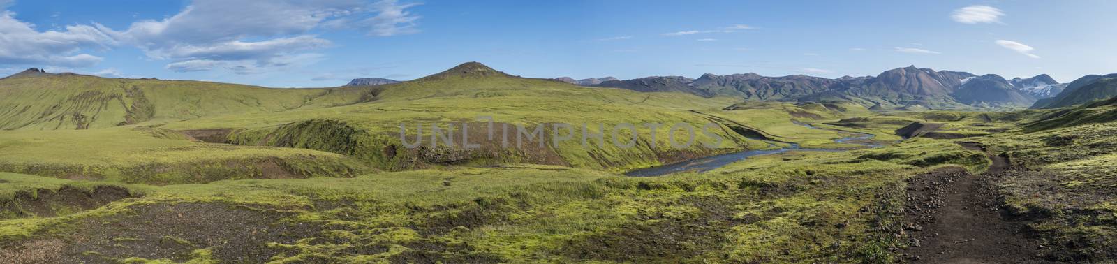 Panoramic landscape with blue river stream, green hills, snow-capped mountains, meadow and lush moss. Laugavegur hiking trail. with Fjallabak Nature Reserve, Iceland. Summer blue sky by Henkeova