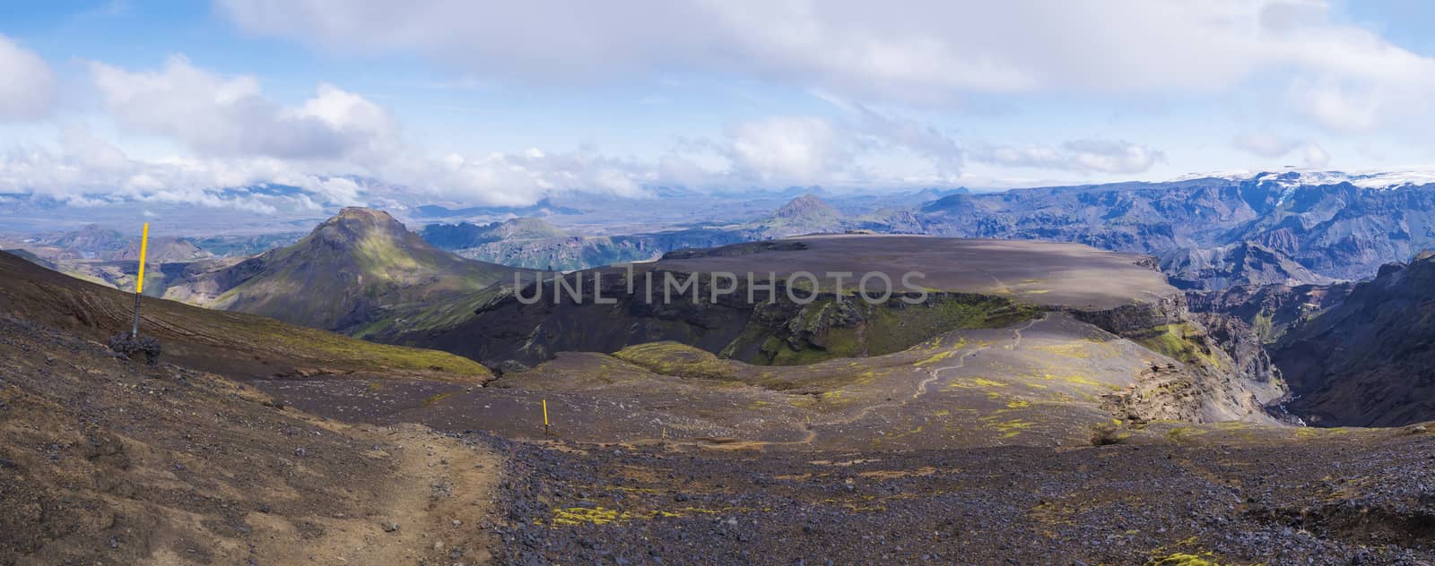 Panoramic breathtaking view on Landscape of Godland and thorsmork over plateau of Morinsheidi with rugged green moss covered rocks and hills. Iceland, Fimmvorduhals hiking trail. Summer cloudy day