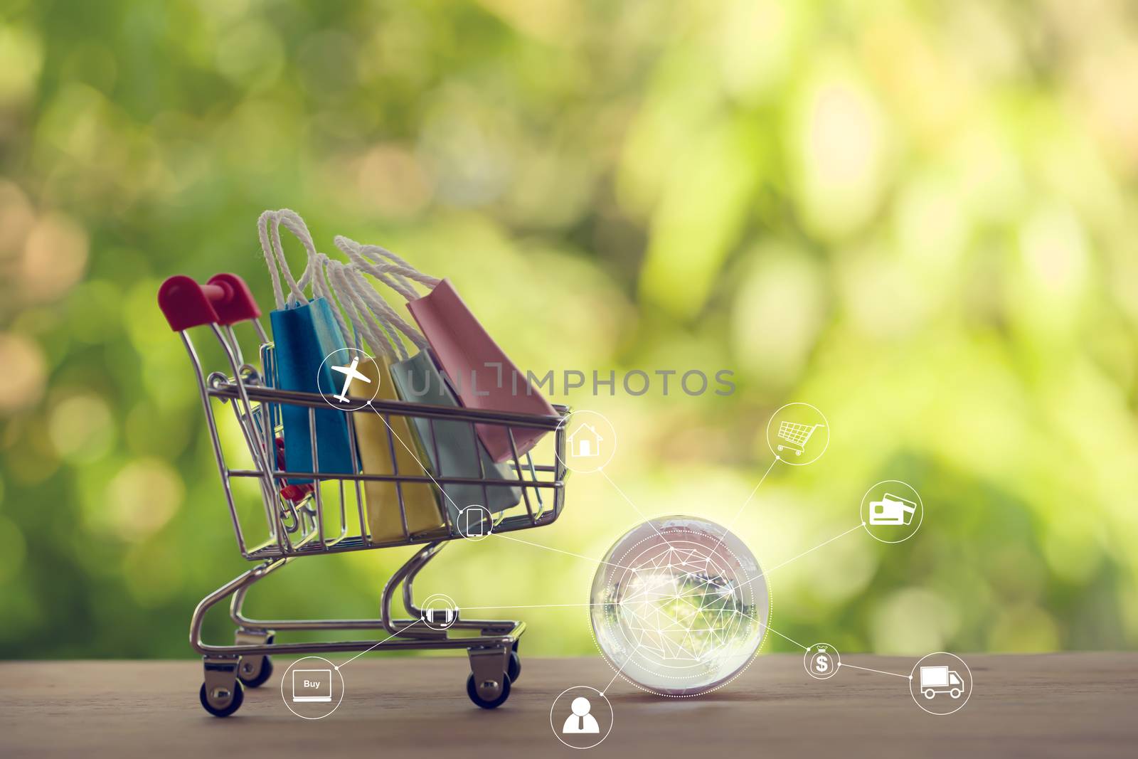 Online shopping, e-commerce concept: Paper shopping bags in a trolley or shopping cart with icon customer network connection. purchase of products on internet can purchase goods from foreign countries