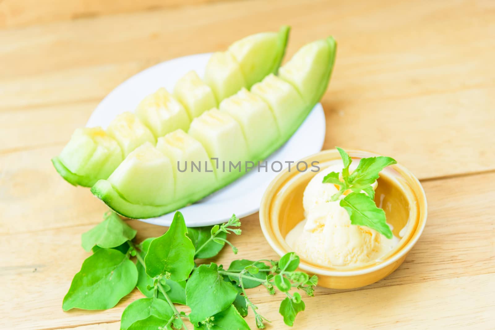 ice cream melon on wood table by rukawajung