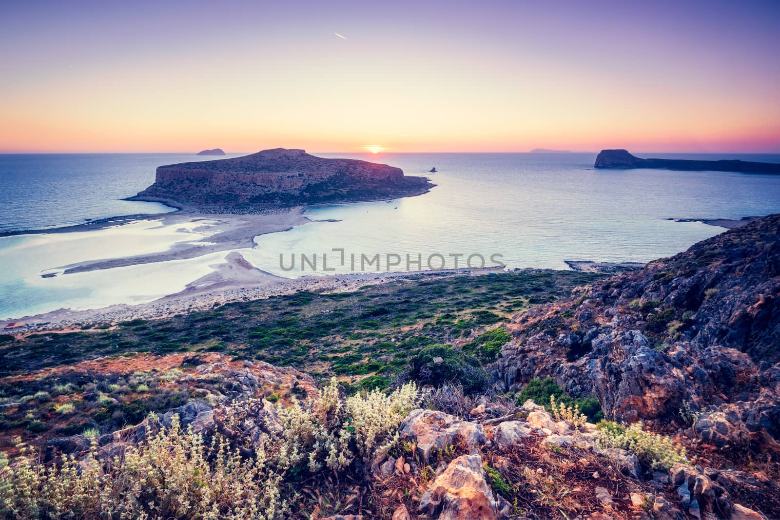 Island Gramvousa and the beautiful Balos beach on sunset in Crete island, Greece. Horizontal camera pan