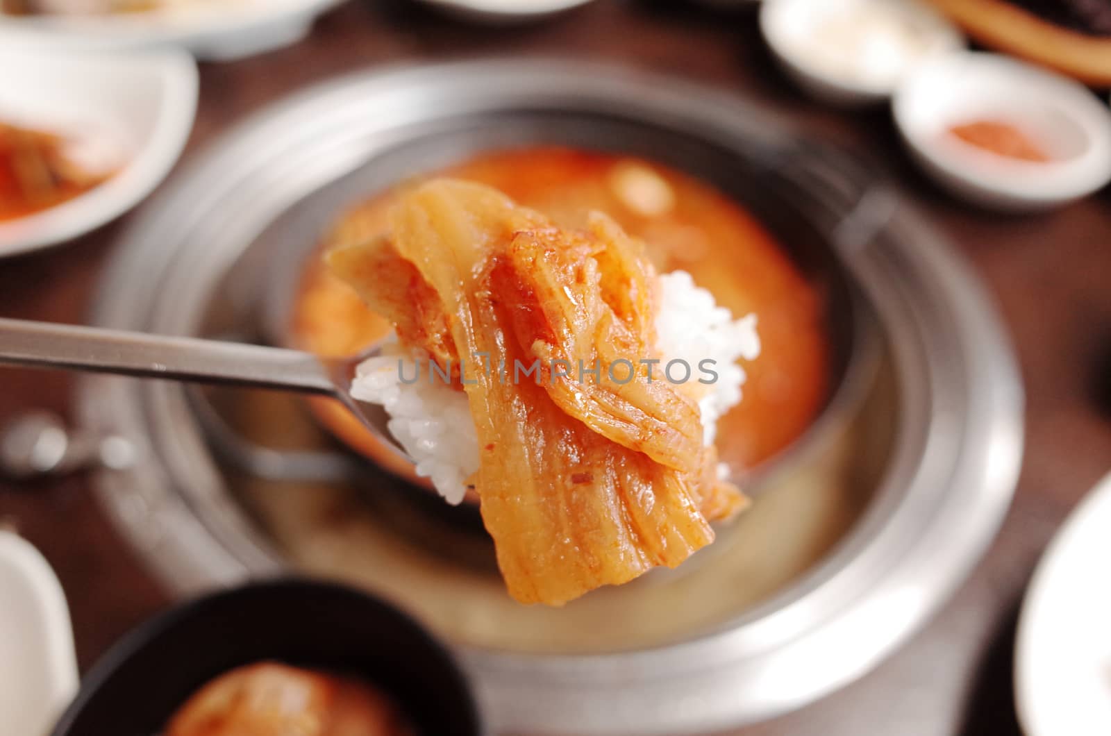 Kimchi with spoon for eating by uphotopia