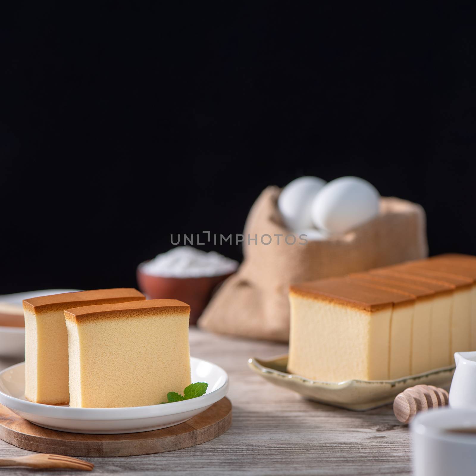 Castella (kasutera) - Delicious Japanese sliced sponge cake food by ROMIXIMAGE