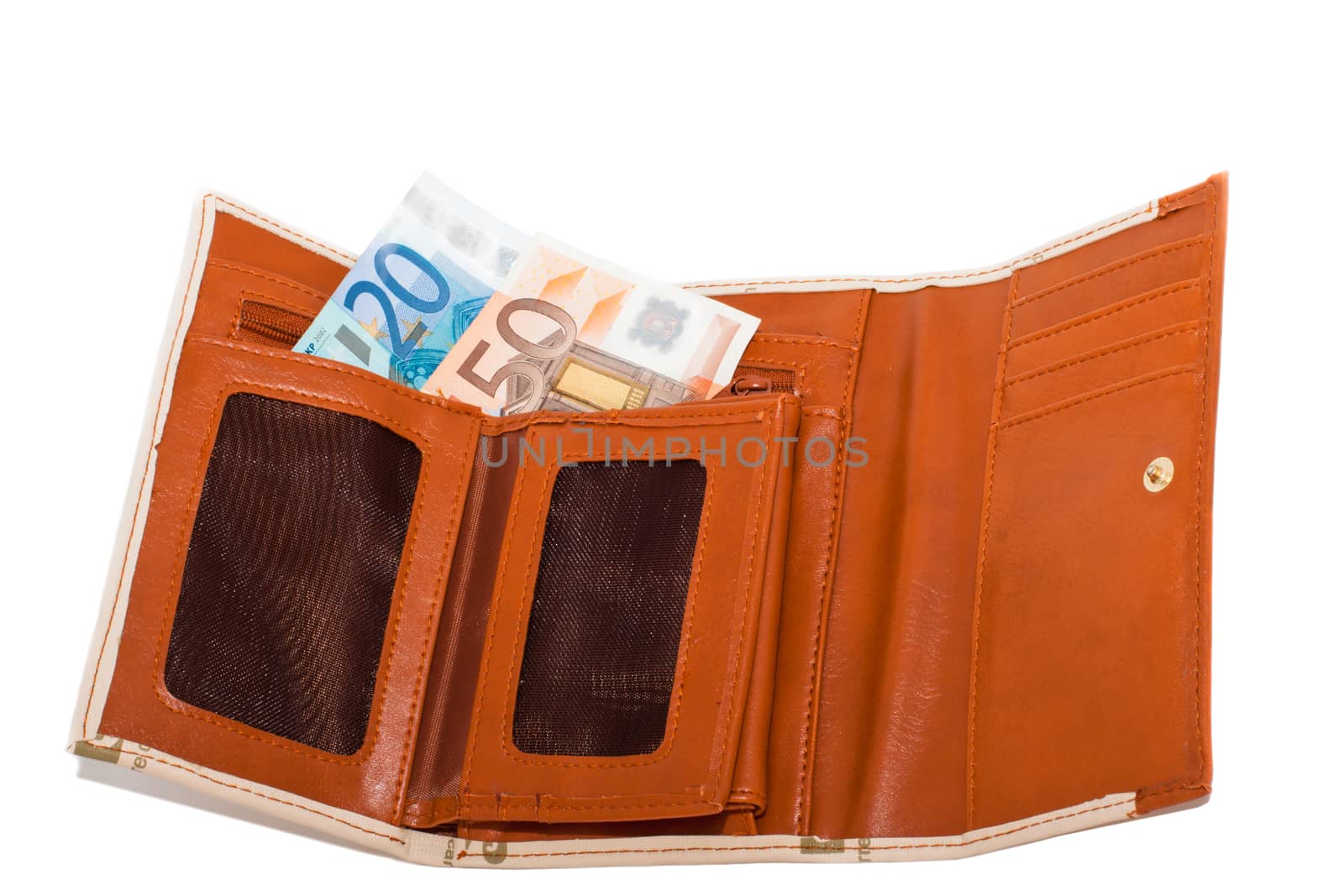 Monetary denominations lie in a wallet on a white background