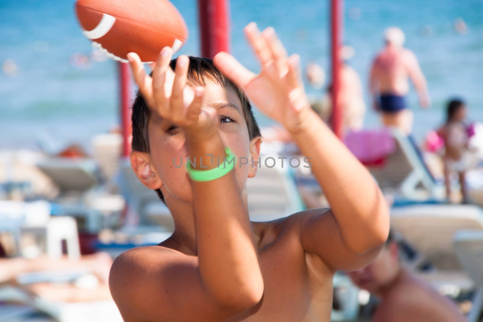 The boy plays with a ball by client111