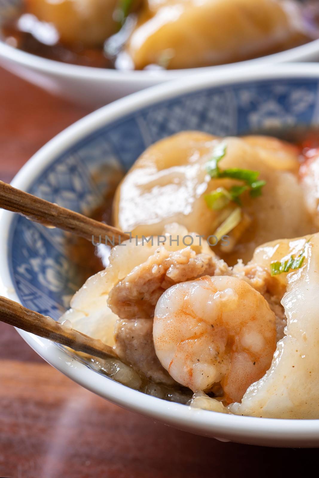 Bawan (Ba wan), Taiwanese meatball delicacy, delicious street food, steamed starch wrapped round shaped dumpling with pork inside, close up, copy space