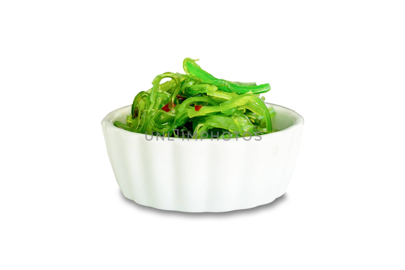 Fresh seaweed salad in white bowl isolated on white background with clipping path.