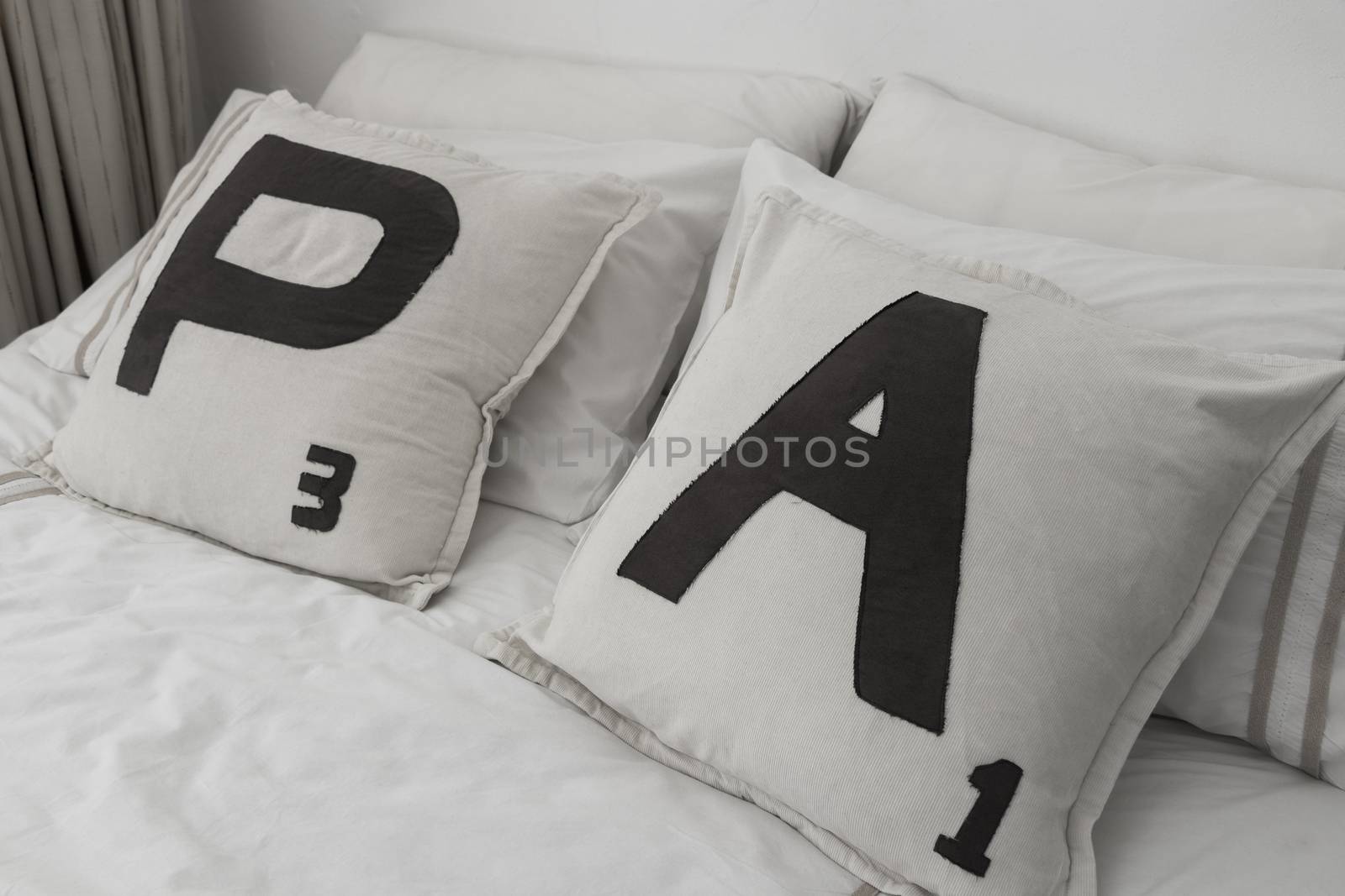 Pillow with letters and numbers. by Arkadij