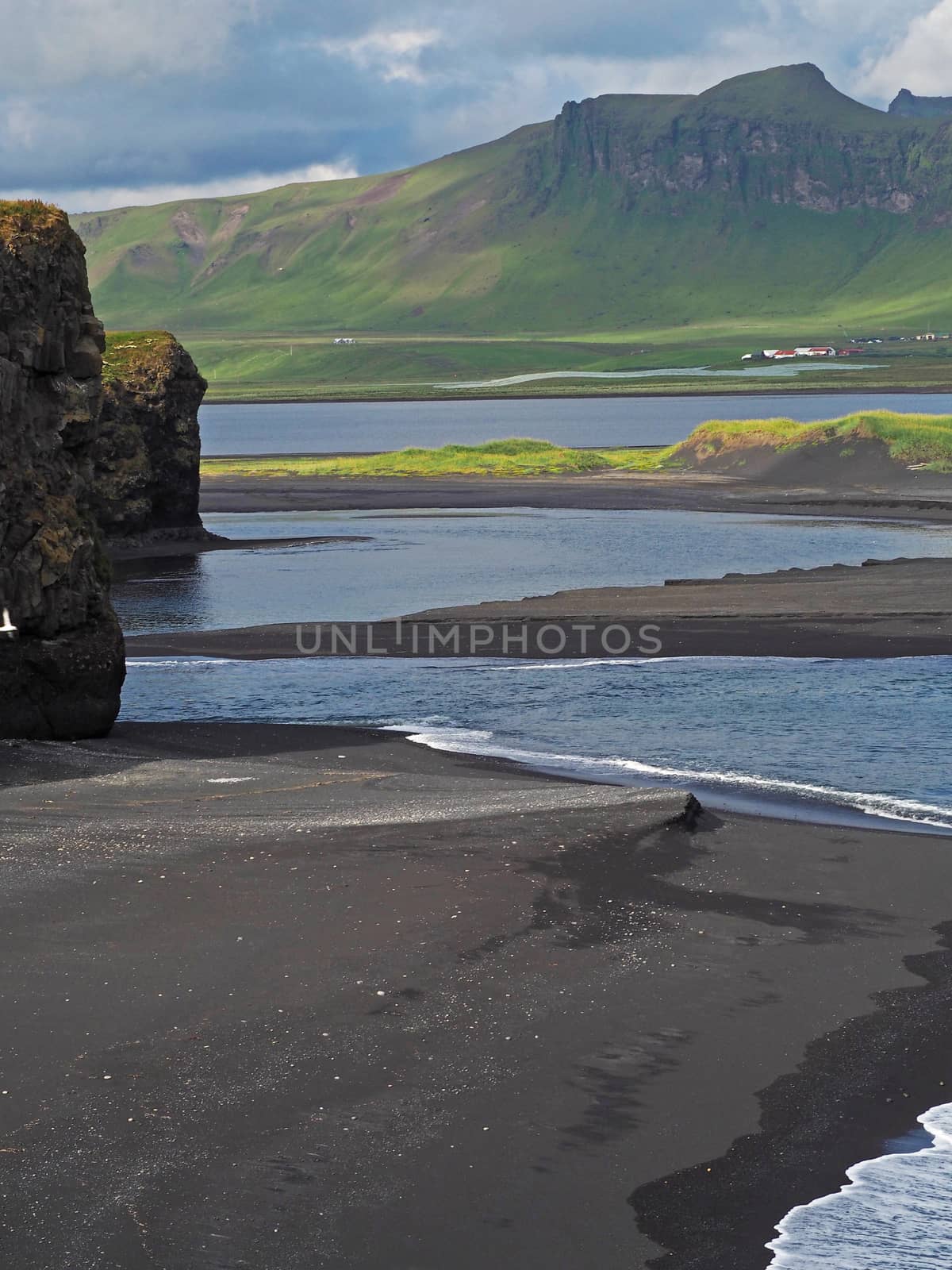 magic iceland landscape with black lava sand and green eroded hills by Henkeova