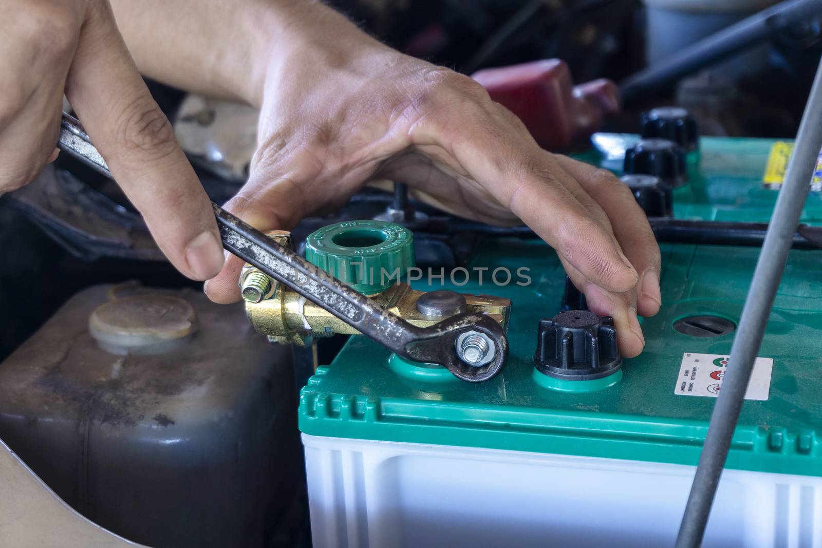 Repairing the battery by a technician from the service center. Service shop Battery repair by yodsawai