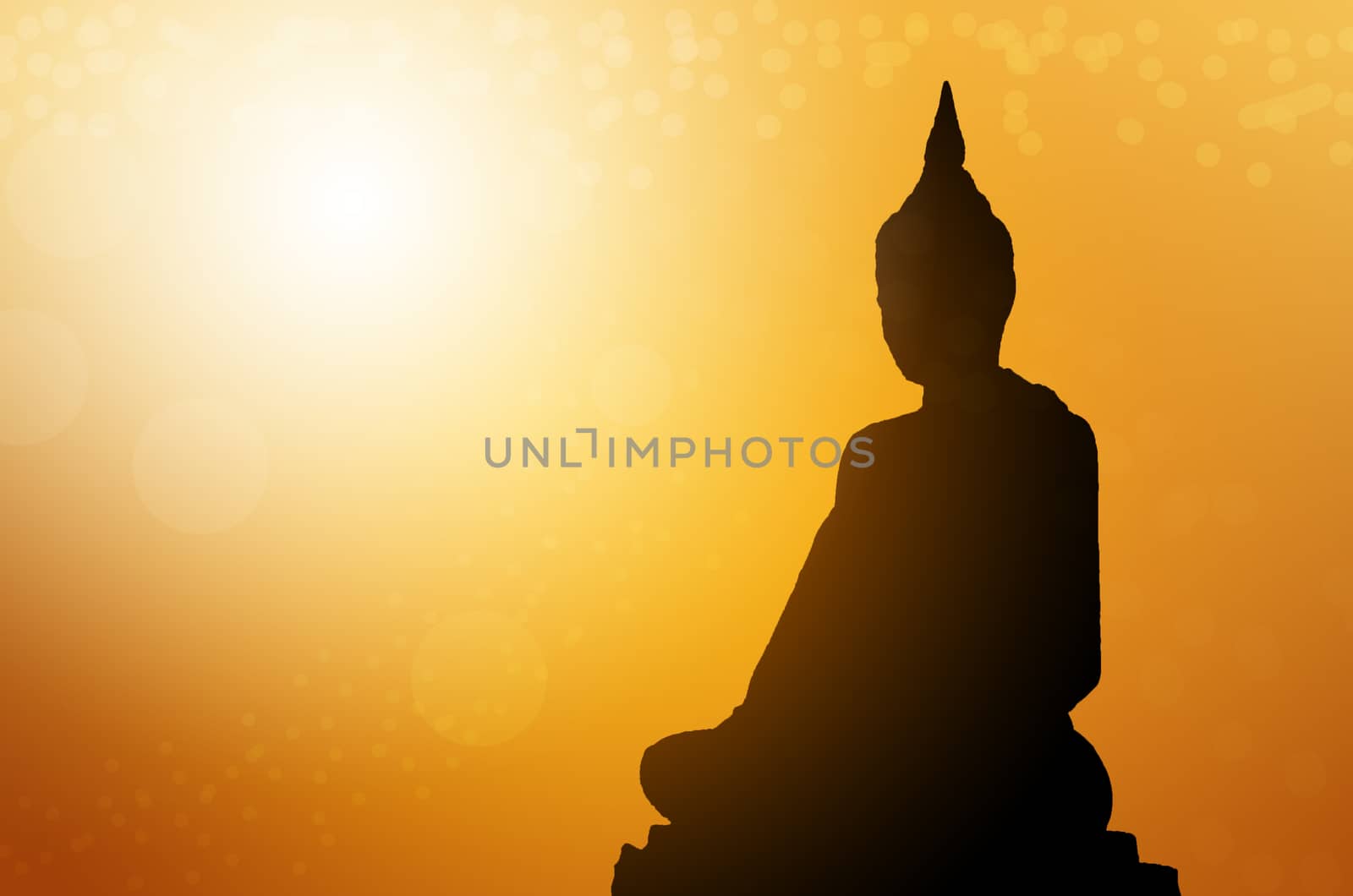 Silhouette buddha statues on blur sunset background. Concept buddha isolated on orange blurred background