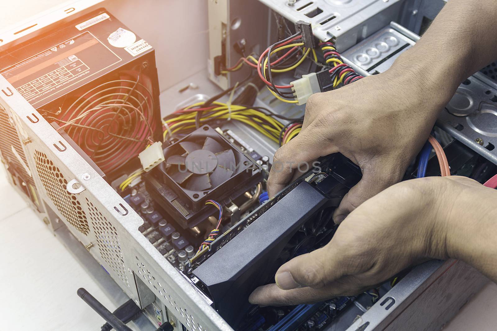 Technician repair graphic card cleaning computer pc. In the computer service center