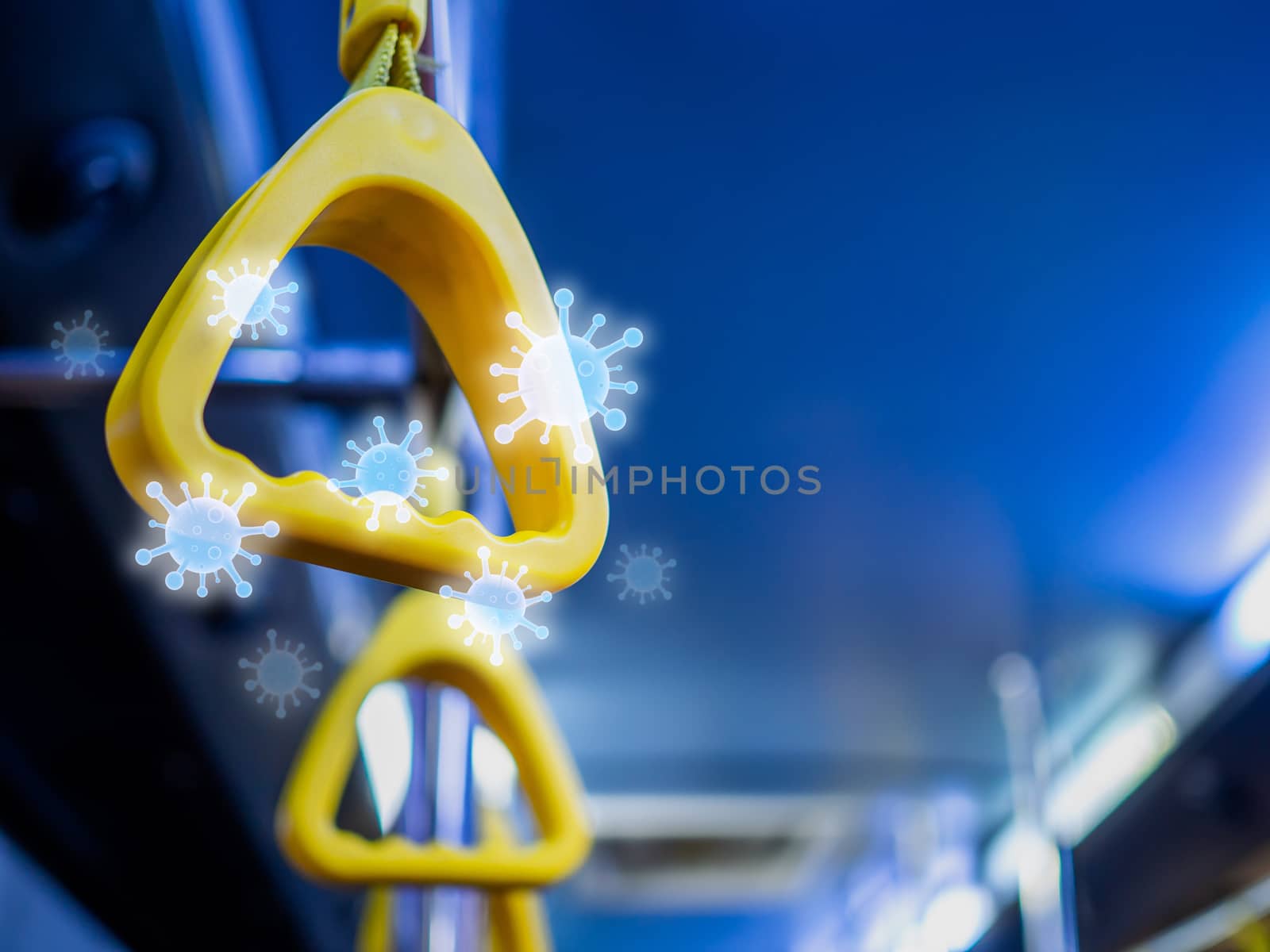 Close-up yellow handles in the shuttle bus with virus floating around with copy space. Virus infection spread disease concept.